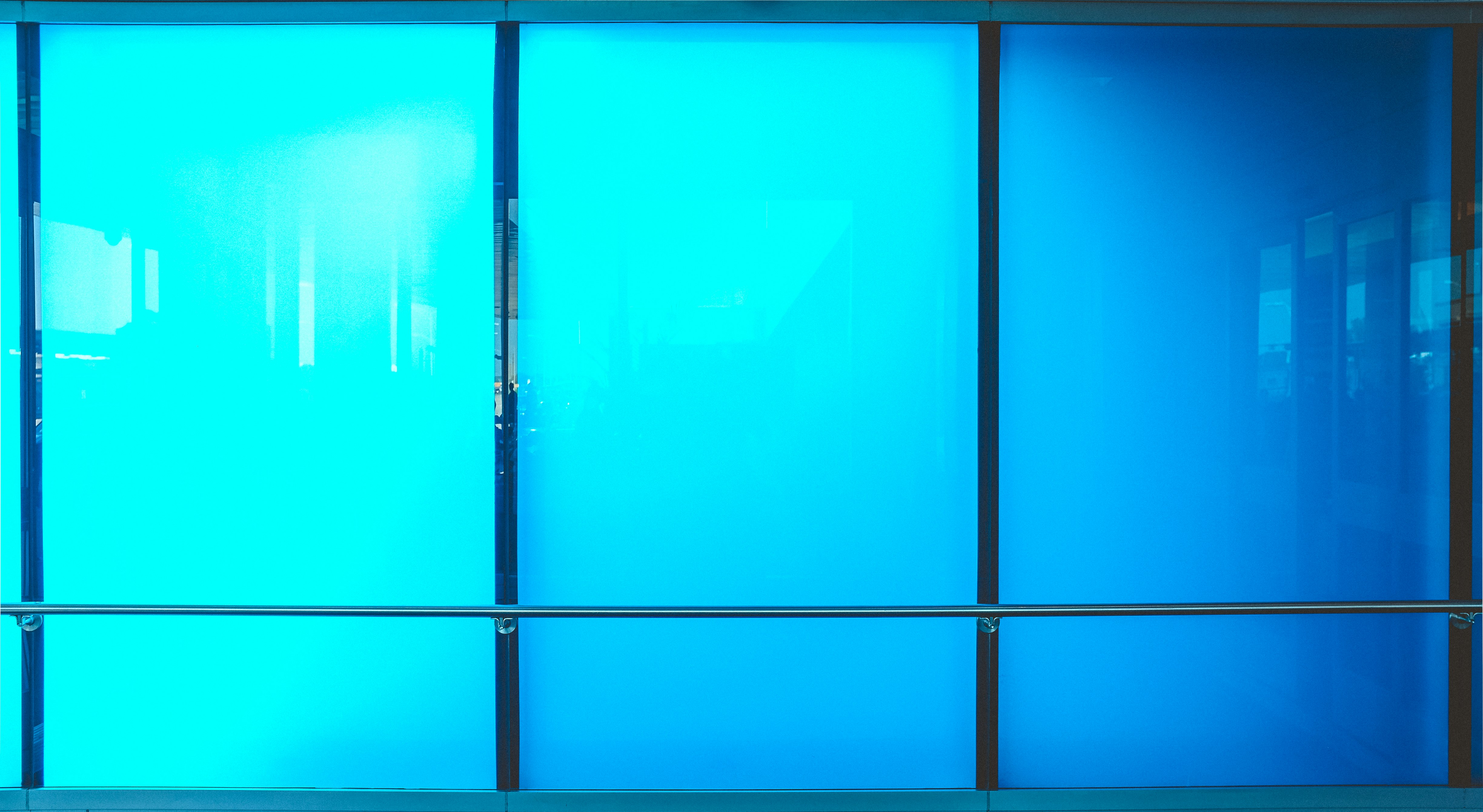 black-framed blue glass window